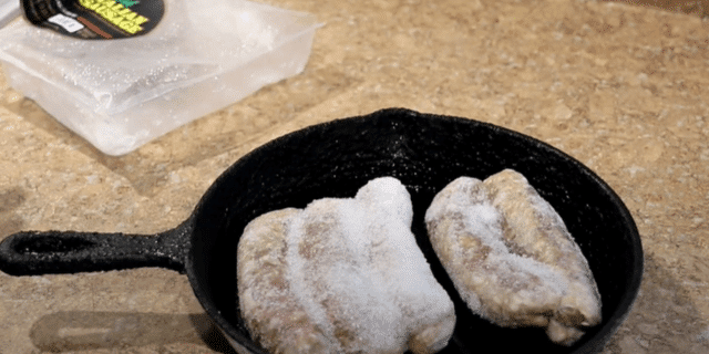 Frozen sausage links baking in oven