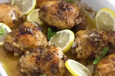 Delicious Roasted Lemon-Sumac Chicken Recipe featuring golden-brown, herb-seasoned chicken thighs with fresh lemon slices and aromatic sumac, baked to juicy perfection in a flavorful citrus-infused marinade.