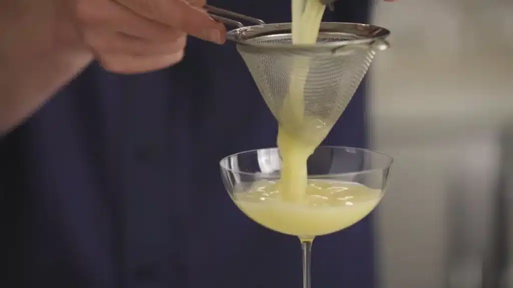 Zesty Lemon San Diego Cocktail with a Tropical Twist 4 Straining Lemon San Diego Cocktail