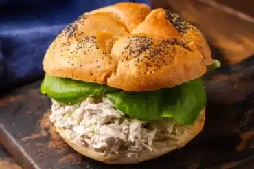 Delicious Arlington Chicken Salad Recipe served on a fresh poppy seed bun with crisp lettuce, perfect for a quick and healthy meal.