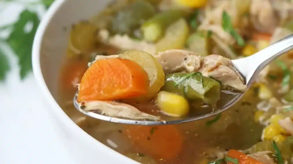 House Special Soup: A Flavorful Journey in Every Spoonful 1 Spoonful of house special soup with chicken, carrots, and bell peppers in a savory broth