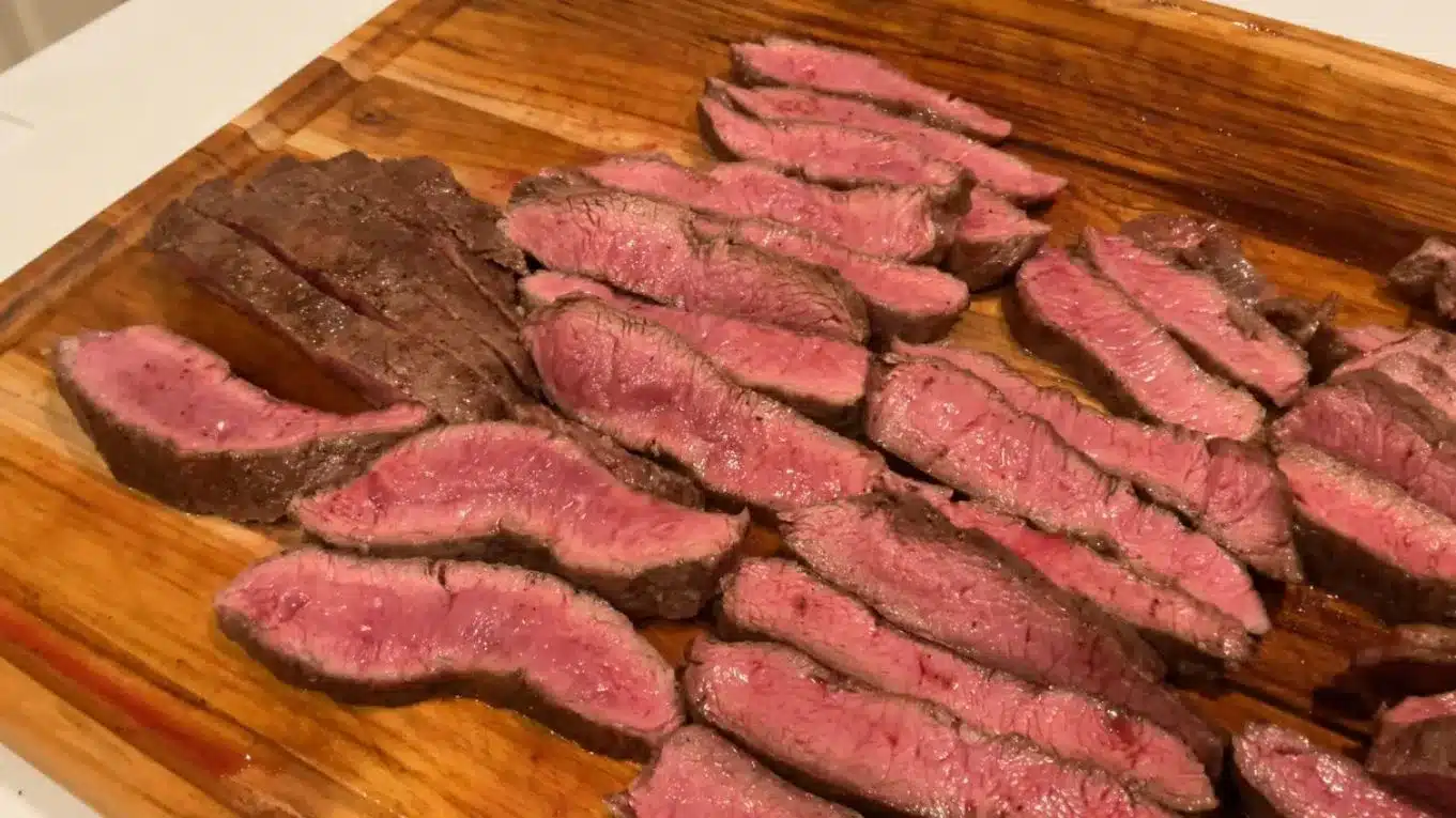 Mangoes & Palm Trees beef archive – perfectly sliced medium-rare flat iron steak on a family table