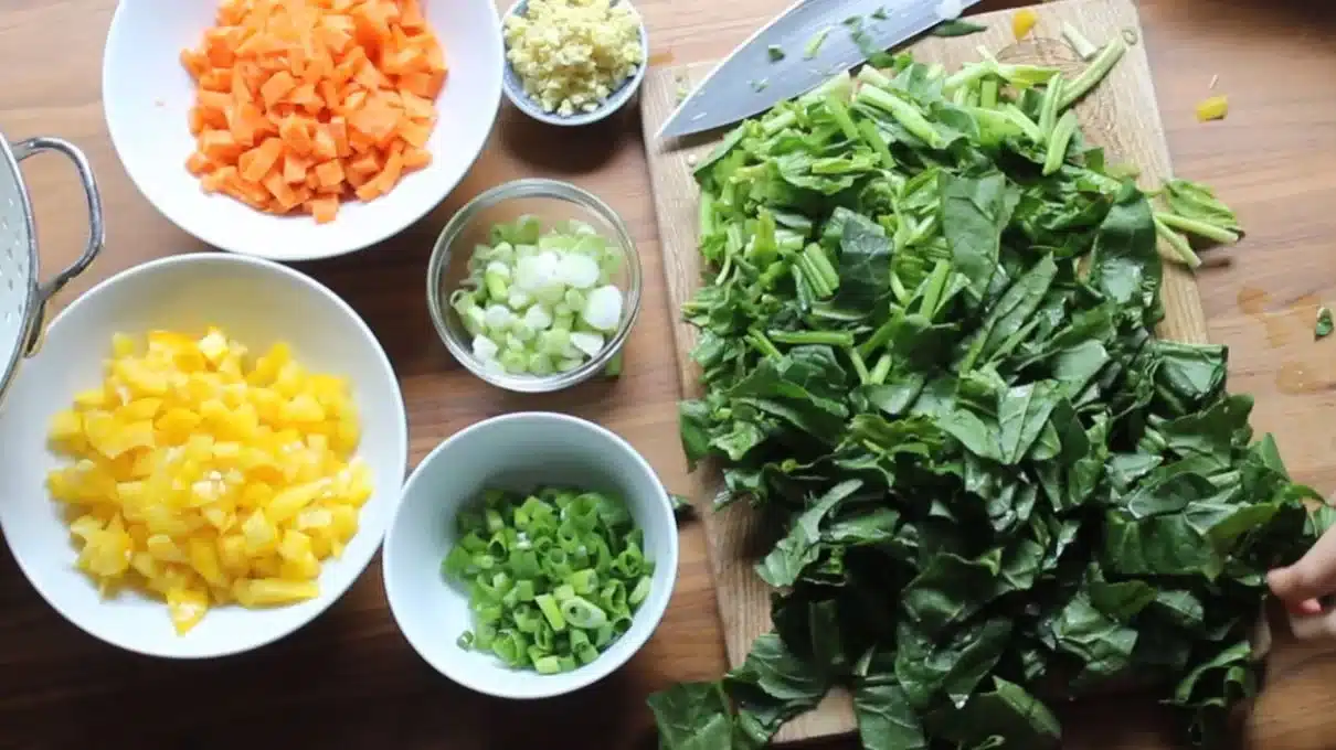 Curry fried rice vegetables: carrots, peppers, and greens ready for the wok