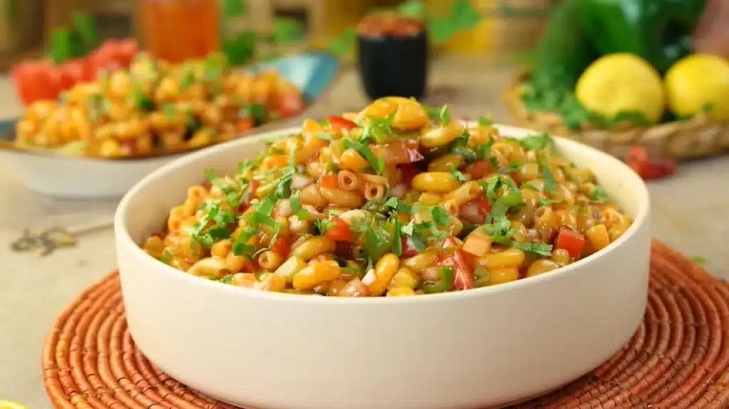 Our Family's Ronzoni Macaroni Salad Recipe: A Tropical Twist 1 A beautifully plated bowl of Ronzoni macaroni salad, showcasing tender pasta, colorful fresh vegetables like bell peppers and celery, and a creamy tropical dressing, garnished with fresh herbs.
