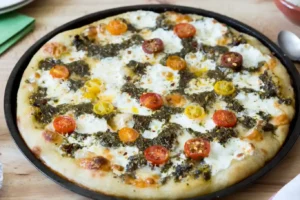 Tomato Halves Chimichurri Recipe for Pizza – Fresh & Flavorful 1 Tomato Halves Chimichurri Recipe for Pizza topped with colorful cherry tomatoes, chimichurri sauce, and melted cheese on a crispy homemade crust.