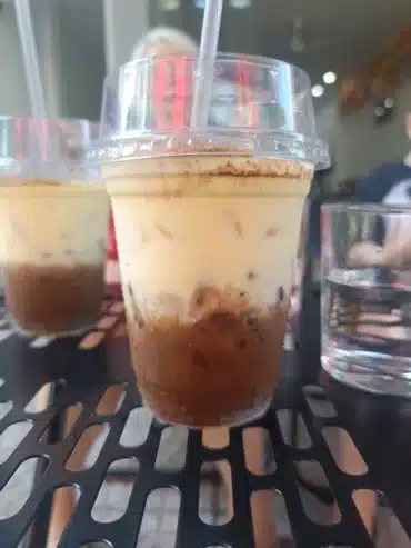 Vietnamese Egg coffee close up on a table outside the coffee shop