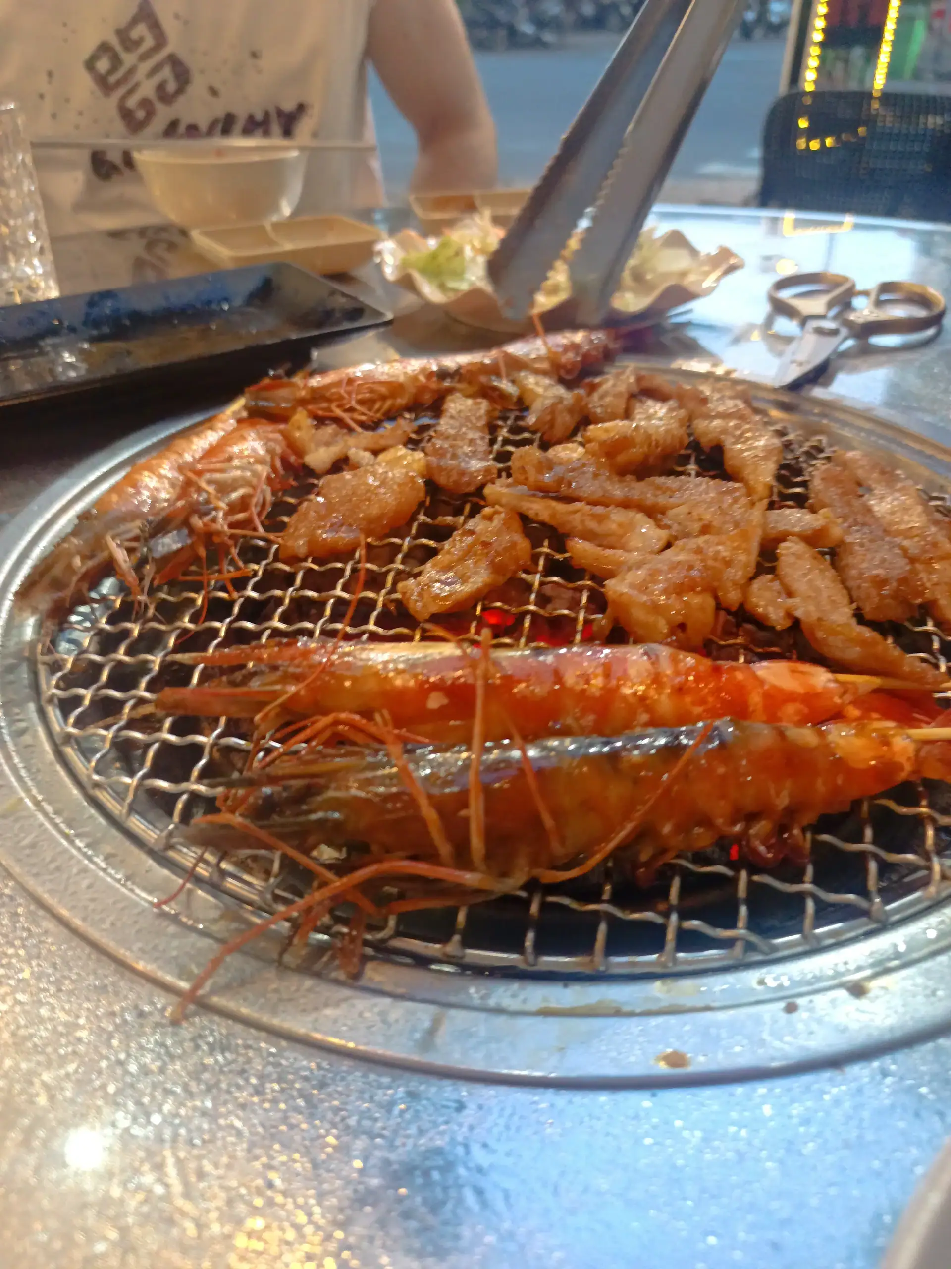 Discover Da Nang in 2025: The Most Comprehensive Travel Guide to Vietnam’s Coastal Gem 13 Prawns and pork cooking on a Korean BBQ in Da Nang, Vietnam