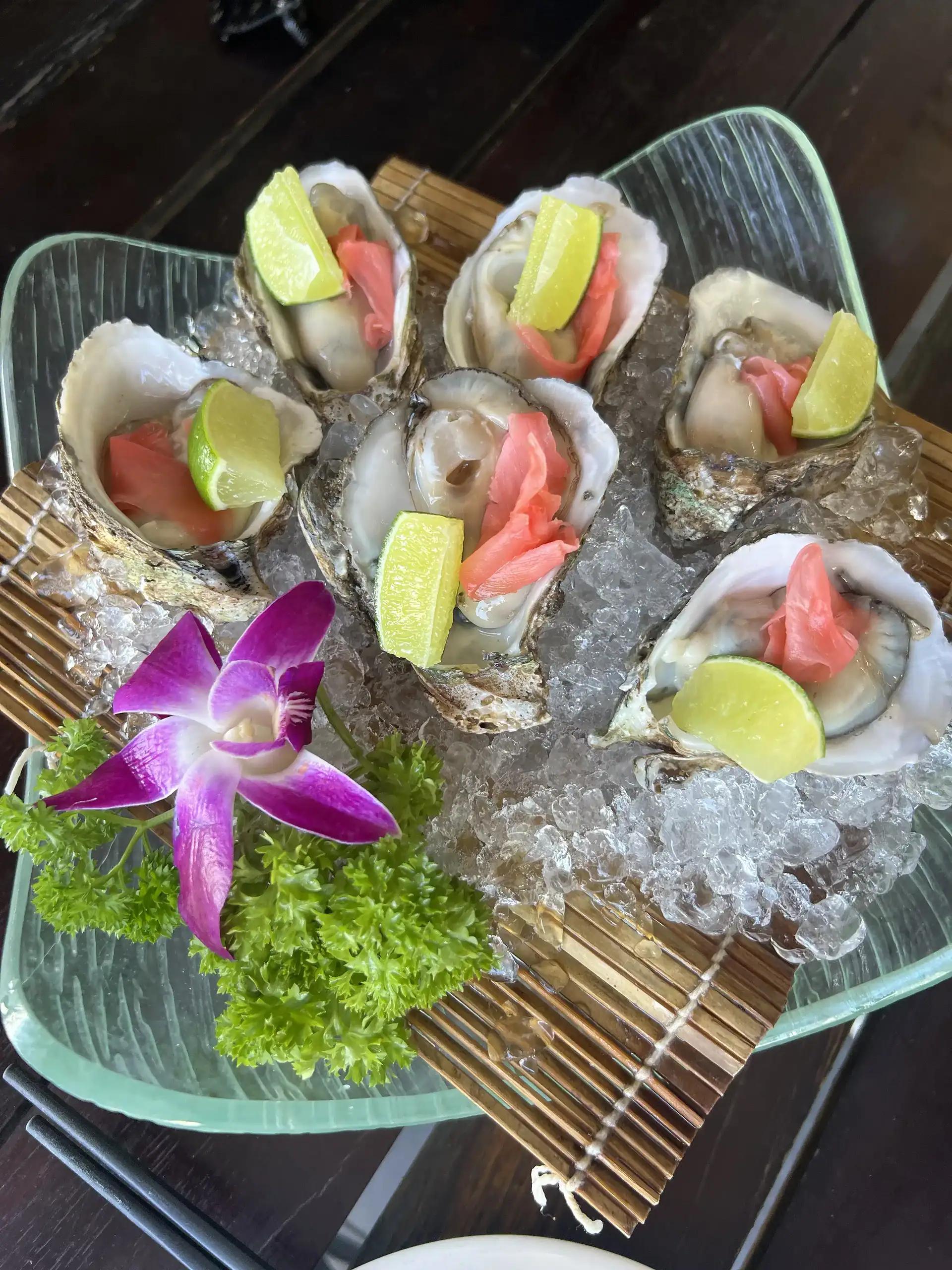 Discover Da Nang in 2025: The Most Comprehensive Travel Guide to Vietnam’s Coastal Gem 10 Fresh oysters on ice with lime and pickled ginger, served in a glass dish for an elegant seafood experience.