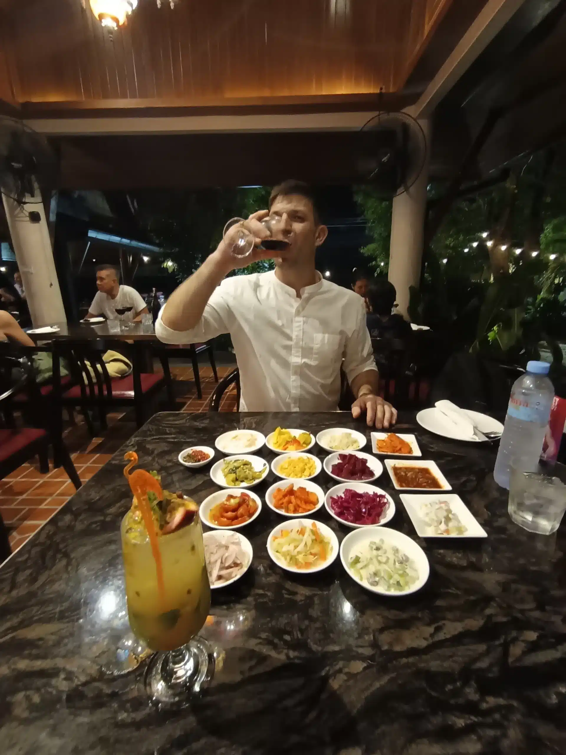 Oliver Mayerhoffer enjoying the breezy patio and garden views at Ogen Soi 94 during our 2026 visit