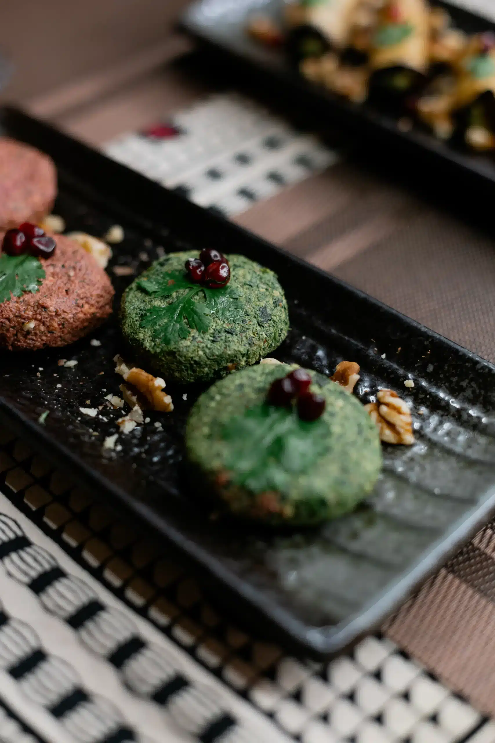 Beetroot and spinach Phali, a traditional Georgian starter made from fresh nuts and herbs, served at Hinkali House Hua Hin.