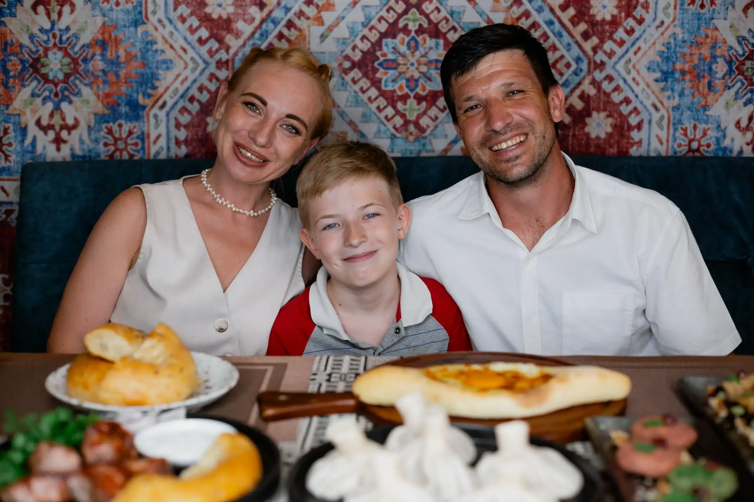 The Mayerhoffer family sharing a meal during fieldwork in Thailand