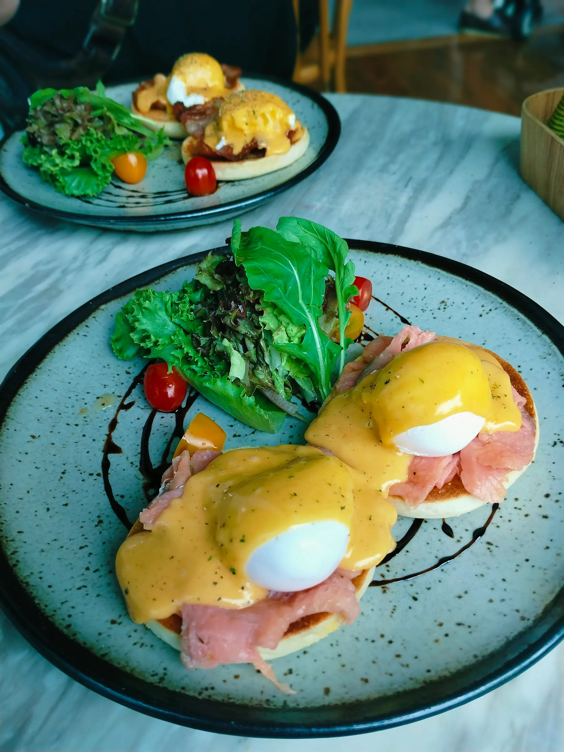 Bangkok street food guide 2026 contrast: standard Eggs Benedict in a modern cafe representing the typical tourist choice.