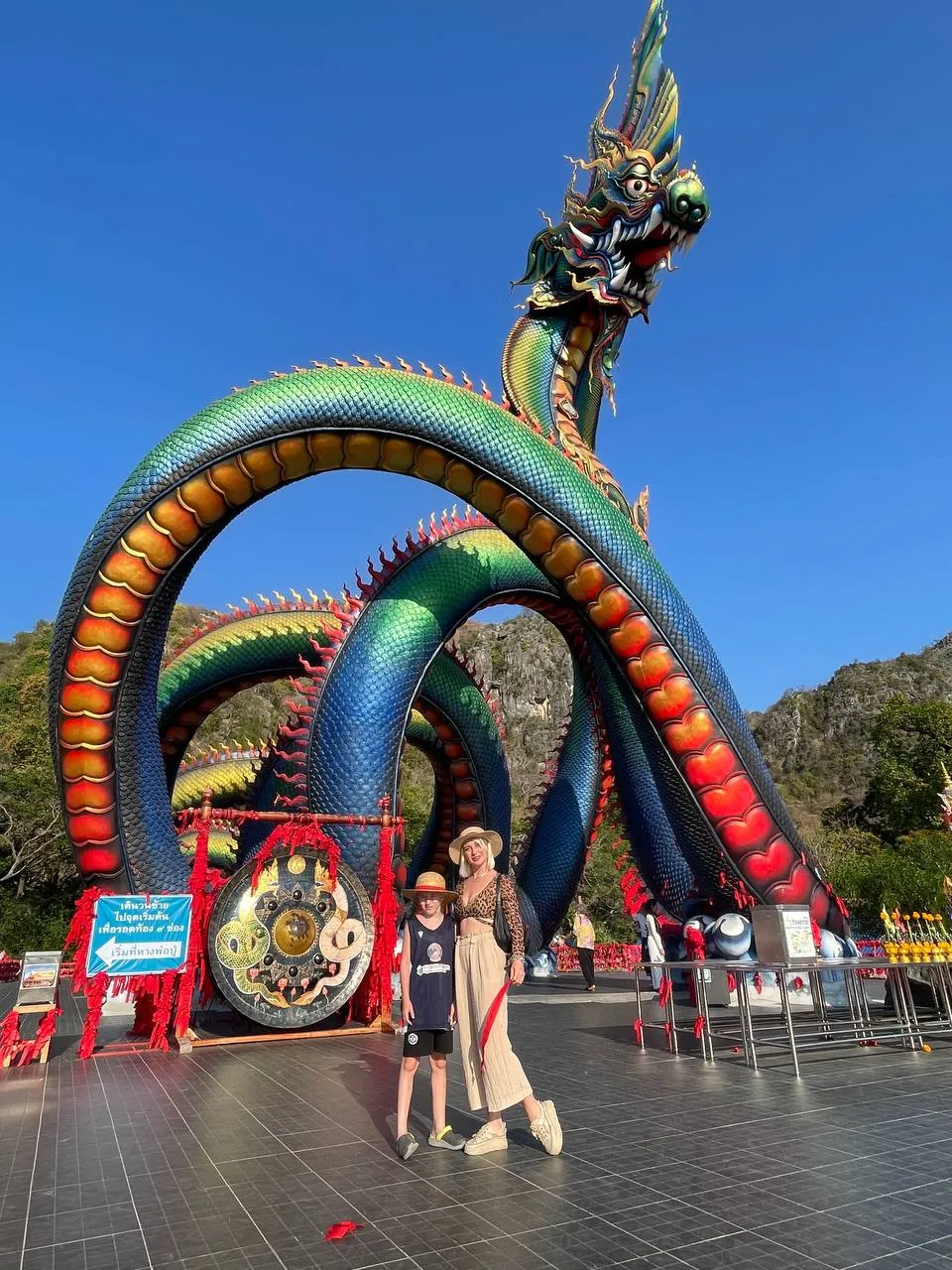 Natalia and Victor Mayerhoffer paying respects at the base of the massive Naga at Wat Tham Chaeng Cha-Am