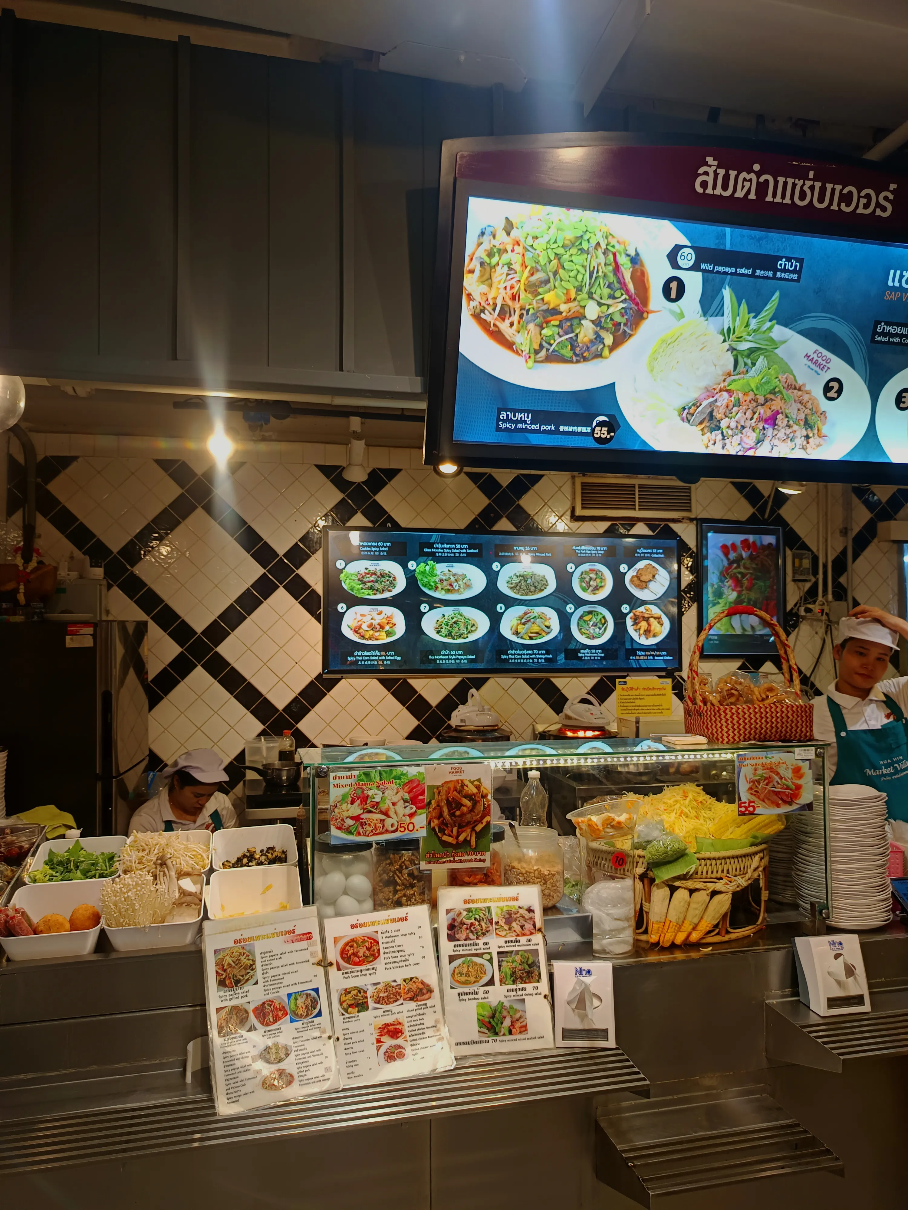 The bustling Street Food Market stalls inside Market Village Hua Hin, showcasing authentic local dining.