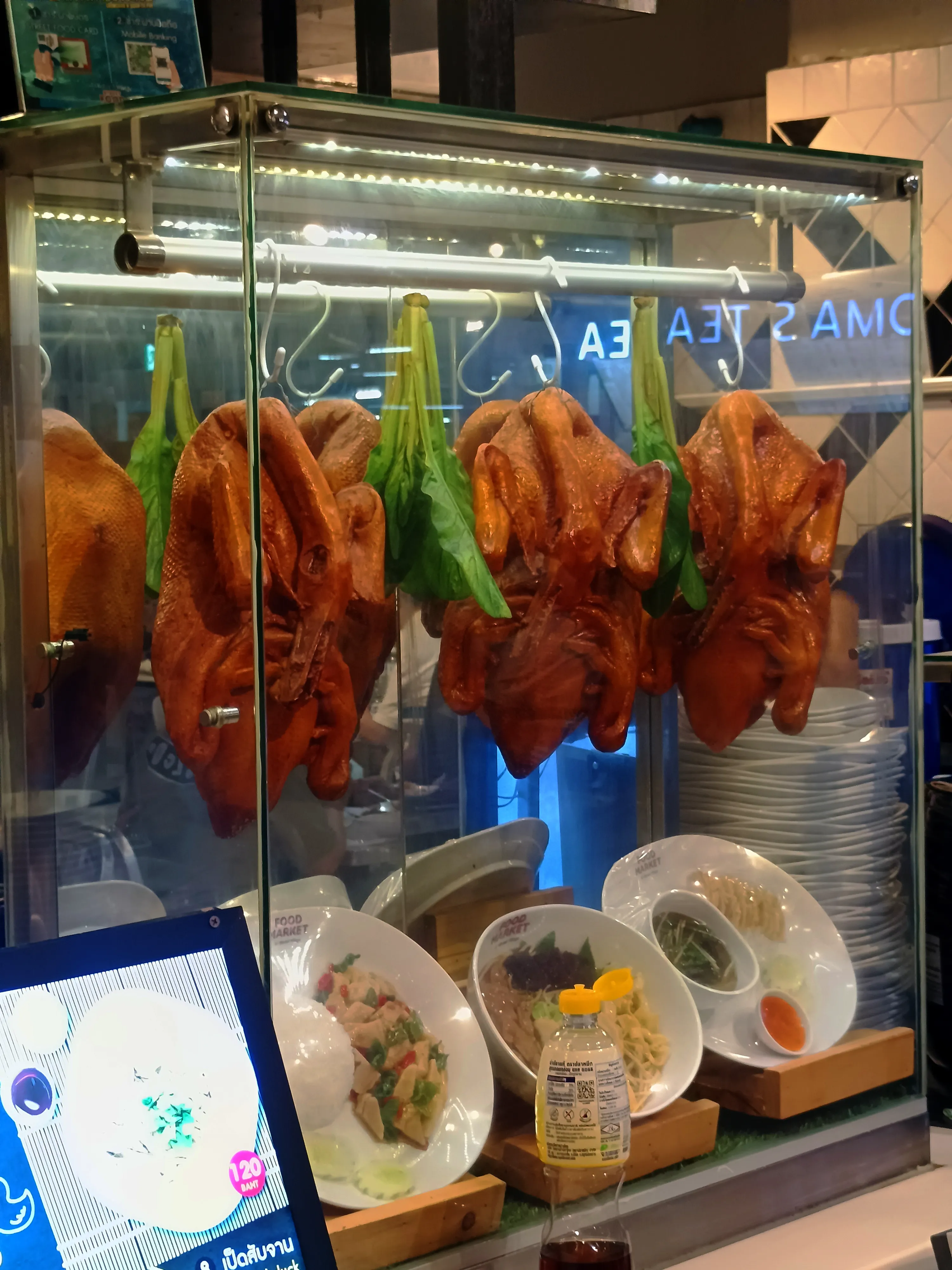 High-quality roasted duck on display at the Market Village Street Food Market.