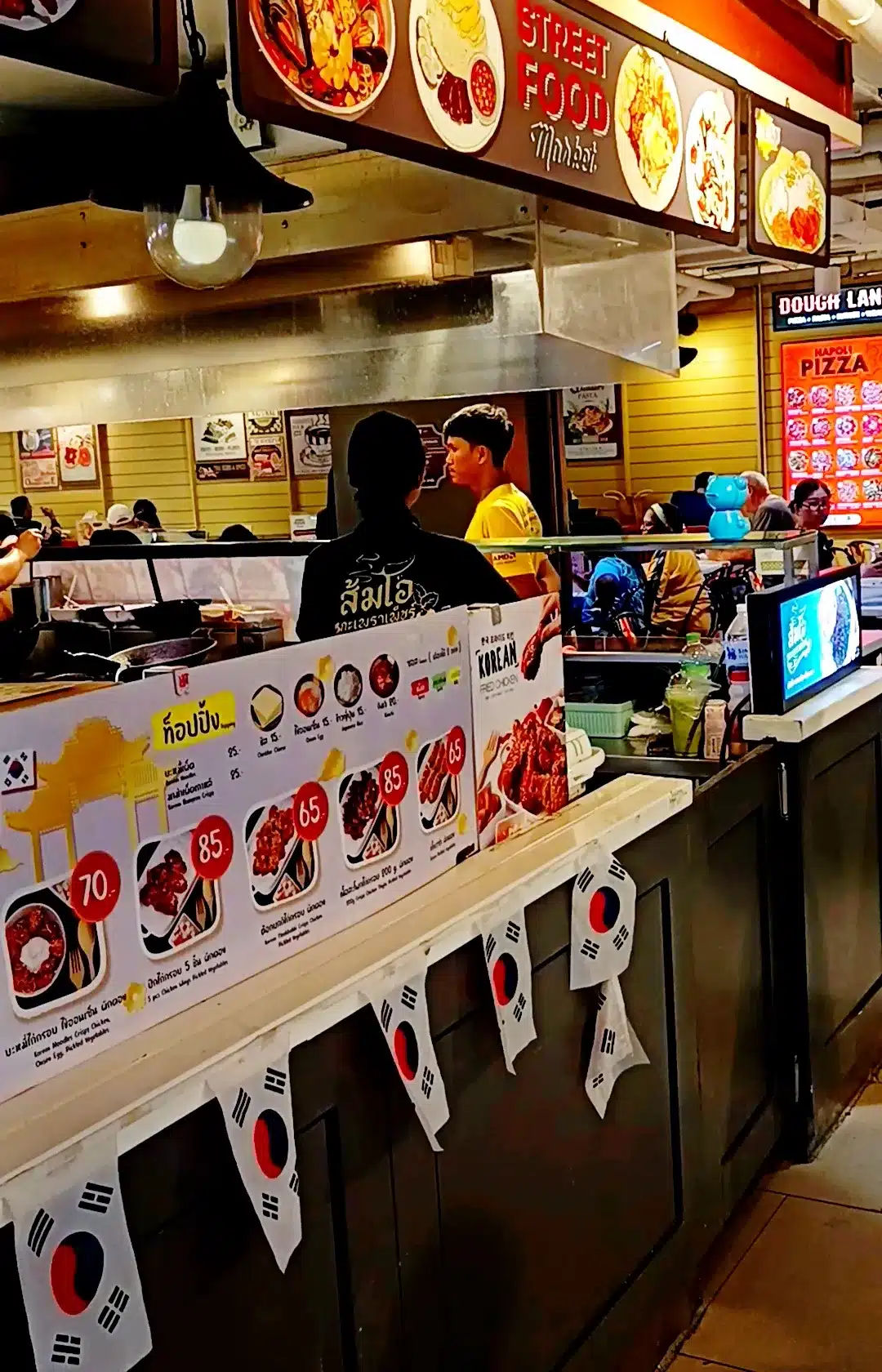 A bustling stall at Market Village, serving authentic Thai food in Hua Hin.