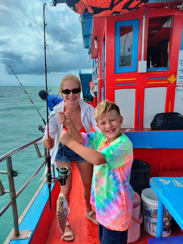 Victor and Natalia with Victor first white snapper on a Mr. Tu family fishing trip, Gulf of Thailand