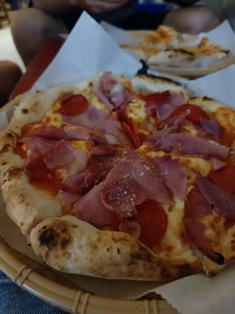 Pizza 100 meat-lover pizza with pepperoni, ham, and melted cheese