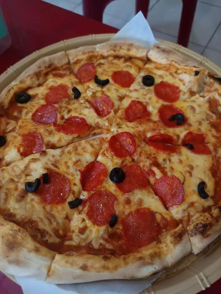 Medium pepperoni pizza with black olives at Pizza 100