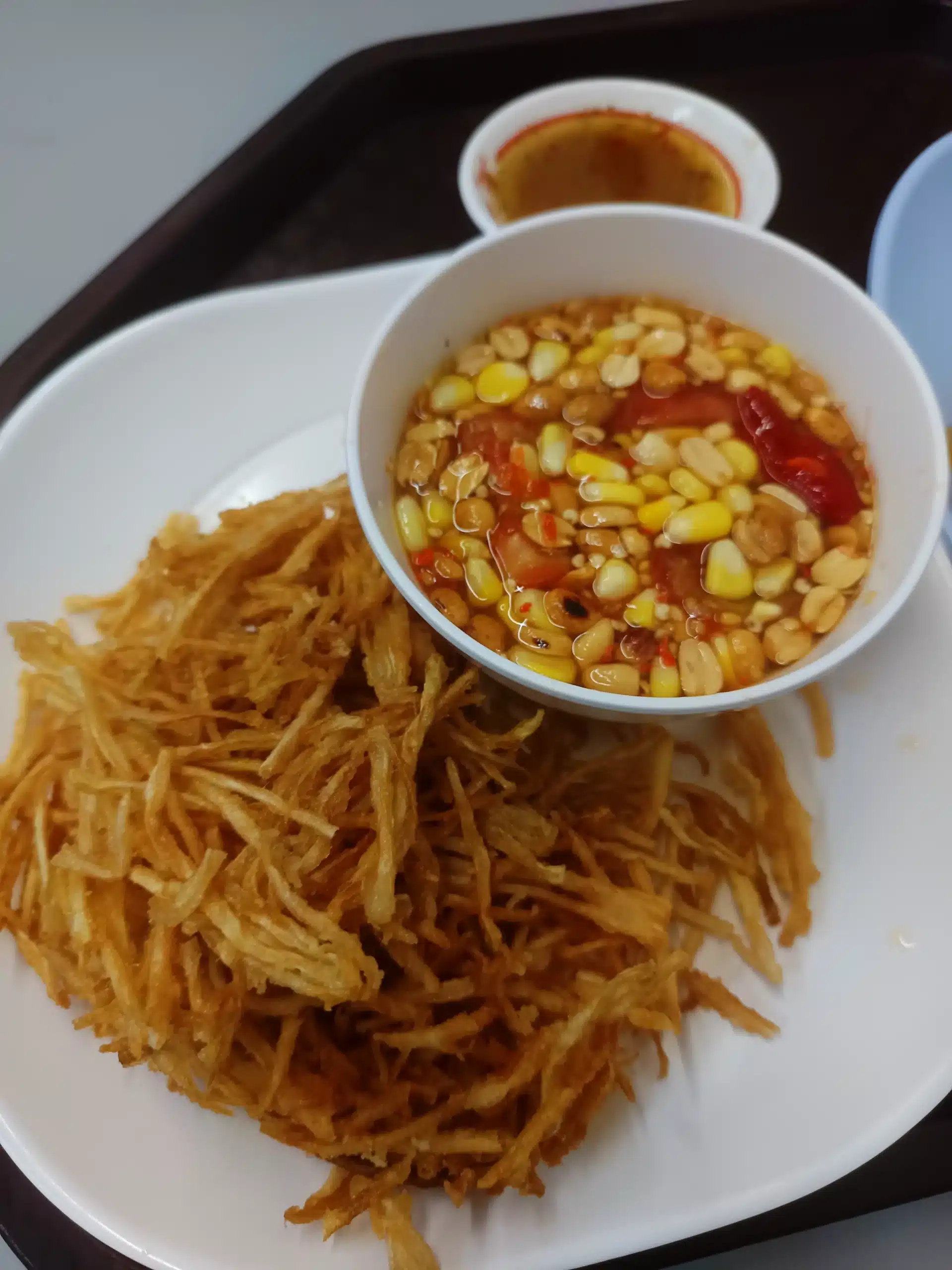 Deep-fried papaya salad at Suvarnabhumi Airport before it is mixed with the dressing